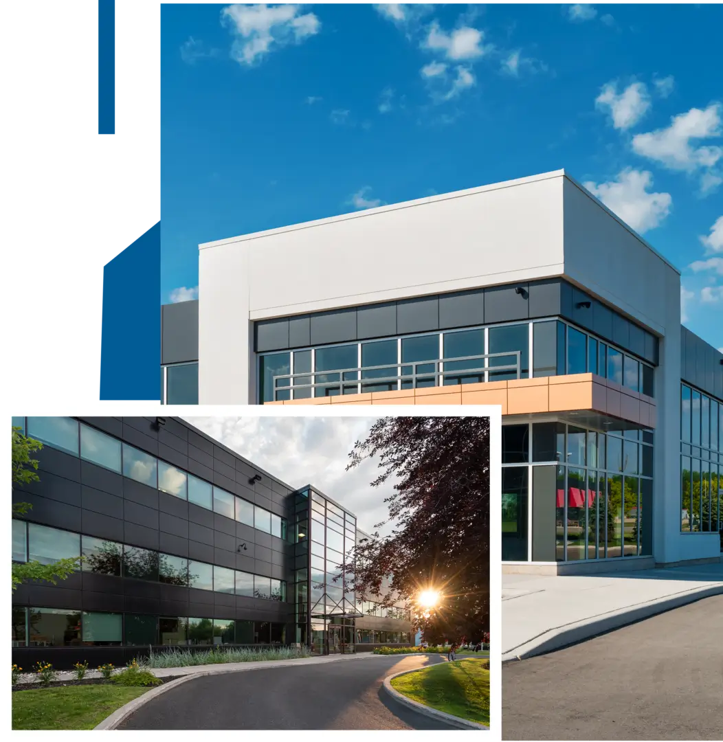 Modern office building with glass windows and clear blue sky.