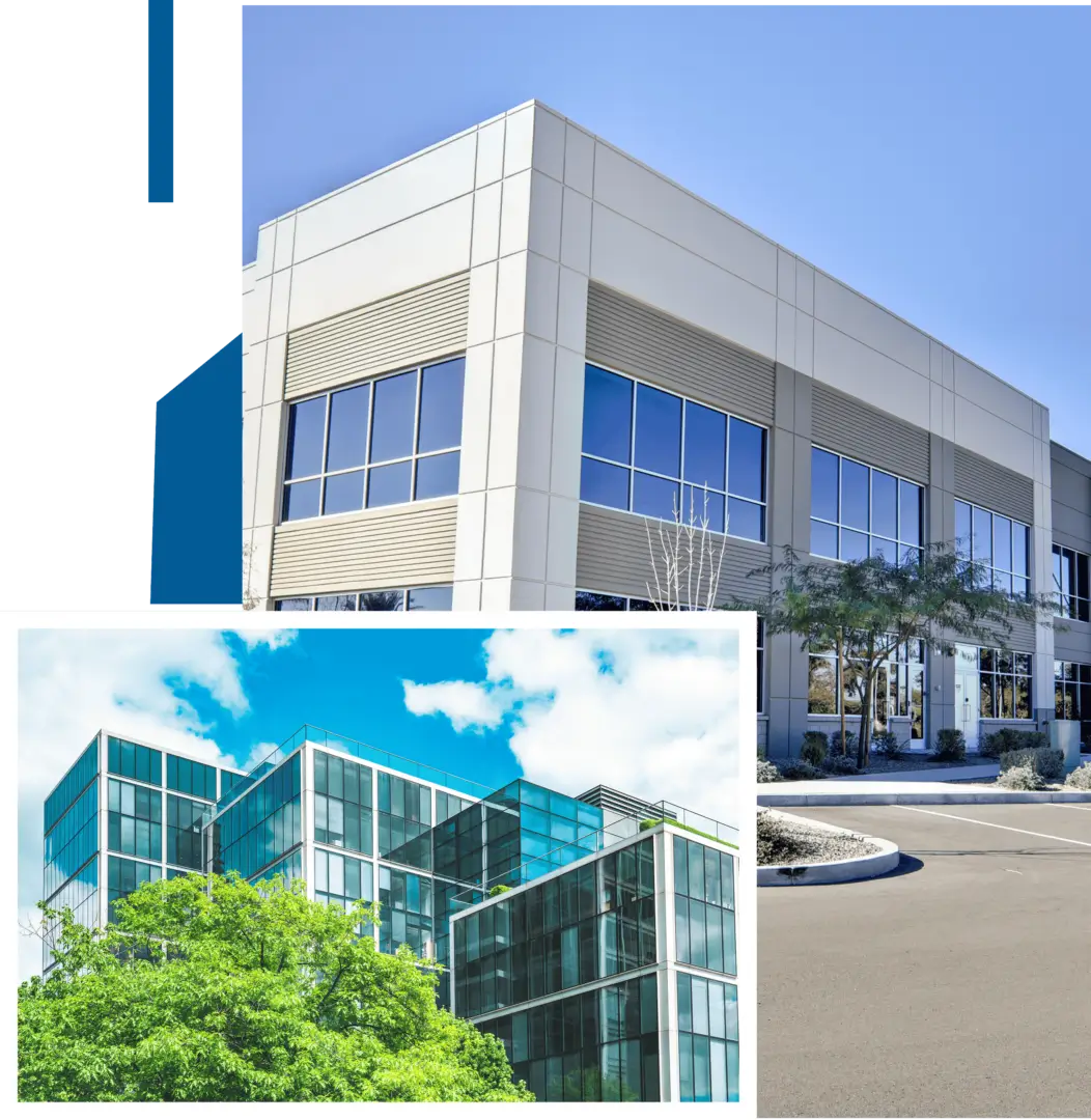 Modern commercial buildings with reflective glass windows under a clear sky.
